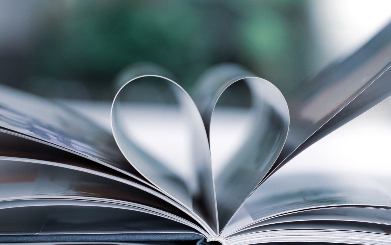 Book pages in the shape of a heart to represent grief healing