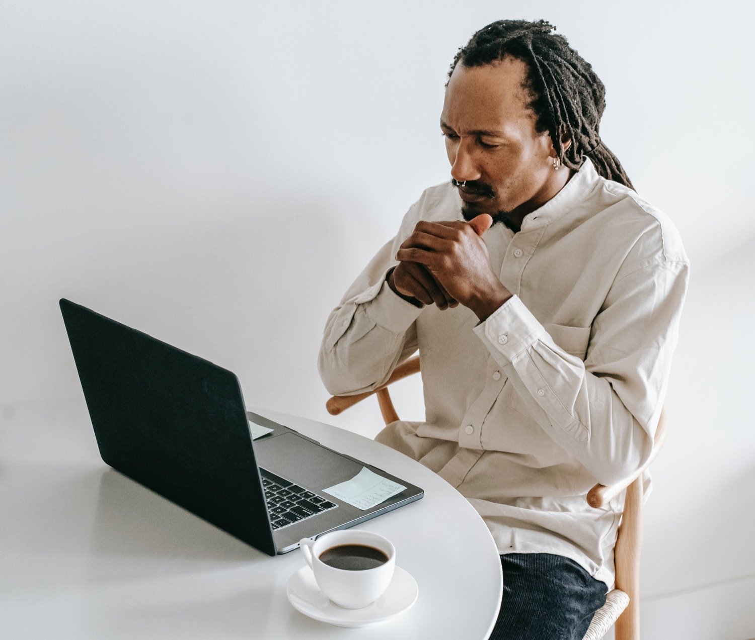 African American man staring at online grief article